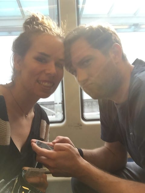 a man and woman on a subway train