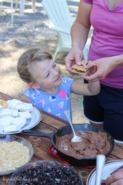 A little girl admiring her S'more 