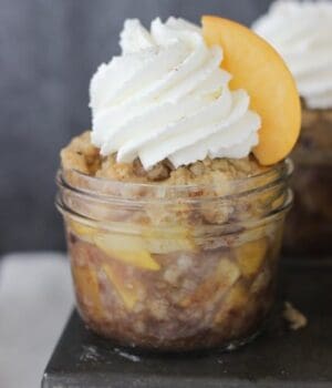 This Peach Maple Walnut Crisps with Champagne Whipped Cream are perfect for summertime. The peaches are soaked in maple syrup, brown sugar and cinnamon and layered with a brown sugar streusel.