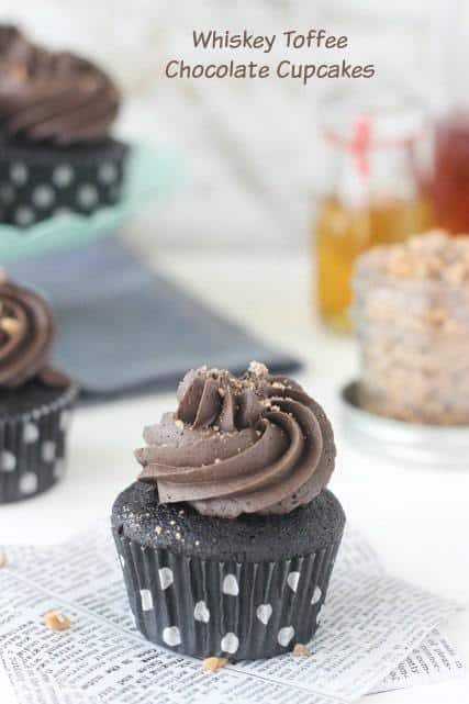 These Whiskey Toffee Chocolate Cupcakes are a surprise in every bite! A dense, whiskey infused chocolate cupcake filled with a spiked chocolate toffee ganache and topped with a whipped chocolate frosting. 