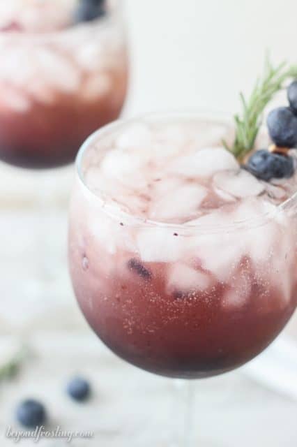 This Blueberry Peach Spritzer features an easy, homemade blueberry syrup with peach juice and prosecco. 