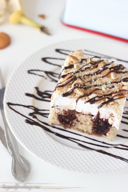 This Chocolate Banana Cream Pie Poke Cake is a moist banana cake filled with chocolate pudding and topped with sliced bananas and whipped cream. 