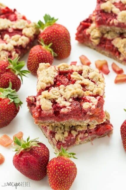 An oatmeal cookie base topped with strawberries and rhubarb and topped with more oatmeal cookie topping -- your favorite summer dessert is now a packable treat or back to school snack!