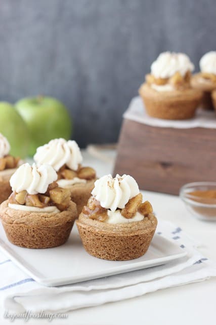 These apple pie cream pie cookies are a soft-baked cake mix cookie filled with a spiced moussed, apple pie filling and topped with whipped cream.