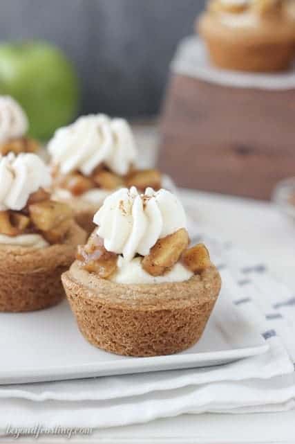 These apple pie cream pie cookies are a soft-baked cake mix cookie filled with a spiced moussed, apple pie filling and topped with whipped cream.