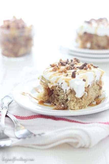 This Caramel Apple Poke Cake is a brown sugar cake with a cinnamon streusel swirl. It is soaked in caramel and topped with apple pie filling and whipped cream.