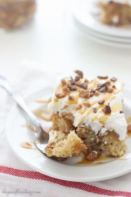 This Caramel Apple Poke Cake is a brown sugar cake with a cinnamon streusel swirl. It is soaked in caramel and topped with apple pie filling and whipped cream.