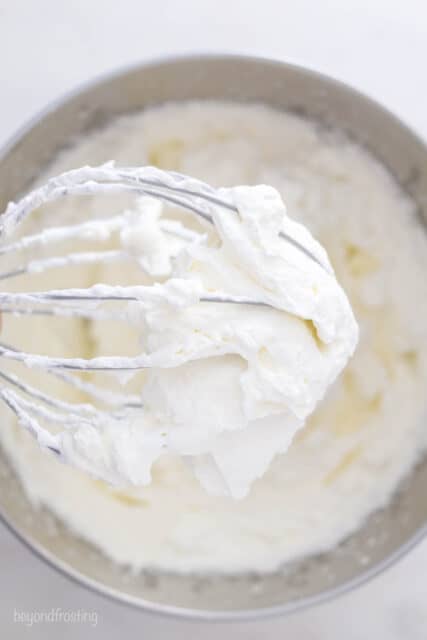 Whipped cream on a standing mixer whisk