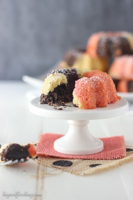 These Mini Neapolitan Bundt Cakes are a blend of vanilla, chocolate and strawberry cake baked together to create the most delicious mini cakes. Finish them off with a dusting of powder sugar. 