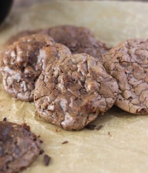 These Triple Chocolate Truffle Cookies are a chocolate lover’s dream. Crispy on the outside and gooey in the middle, these brownie-like cookies are inspired by a cookie from Dahlia’s Bakery in Seattle.