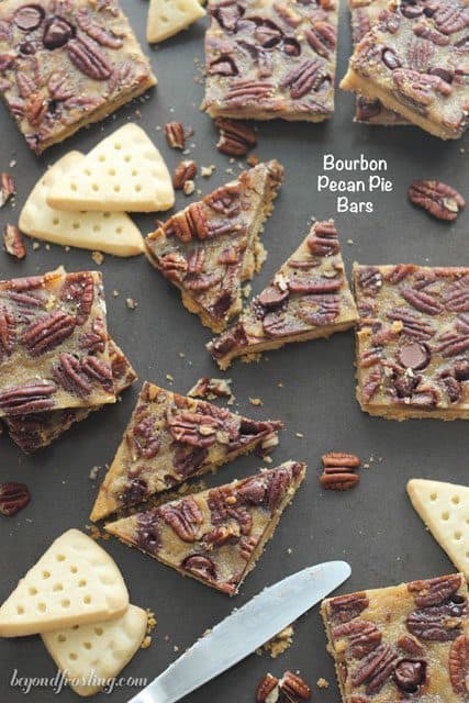 These Bourbon Pecan Pie Bars feature a buttery shortbread crust with a bourbon spike filling loaded with pecans and chocolate chips. 