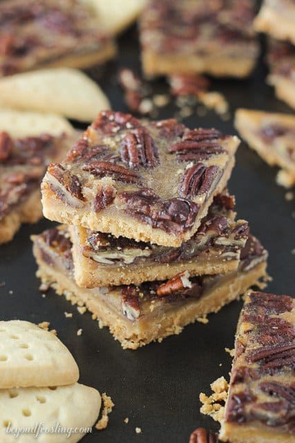 These Bourbon Pecan Pie Bars feature a buttery shortbread crust with a bourbon spike filling loaded with pecans and chocolate chips.