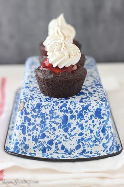 Dark Chocolate Pudding Cookies with a chocolate mousse filling and cherry pie. Topped with whipped cream.