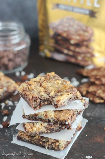 Gooey Brownie Brittle Toffee Seven Layer Bars. The Brownie Brittle crust is layered with coconut, toffee, chocolate and walnuts