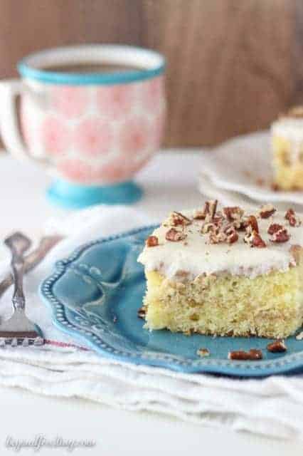 This Cinnamon Coffee Cake Poke Cake is a vanilla cake with a streusel swirl, soaked in sweetened condensed milk and topped with a cream cheese glaze.