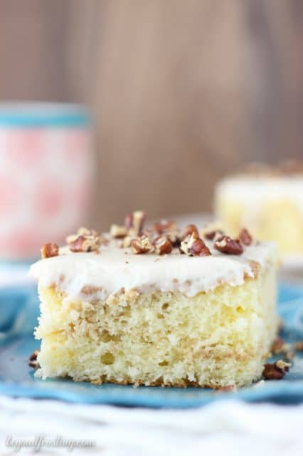 Cinnamon Swirl Poke Cake with a vanilla cream cheese glaze. 