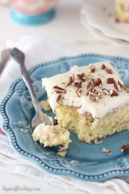 This Cinnamon Coffee Cake Poke Cake is a vanilla cake with a streusel swirl, soaked in sweetened condensed milk and topped with a cream cheese glaze. 