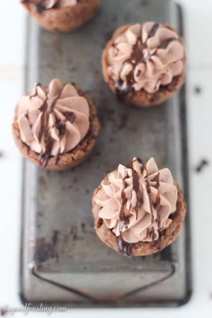 These Hot Chocolate Cookie Cups are a perfect treat to enjoy this winter. It’s a hot chocolate cookie filled with hot chocolate whipped cream and drizzled with more chocolate.