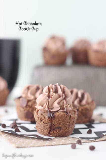 These Hot Chocolate Cookie Cups are a perfect treat to enjoy this winter. It’s a hot chocolate cookie filled with hot chocolate whipped cream and drizzled with more chocolate.