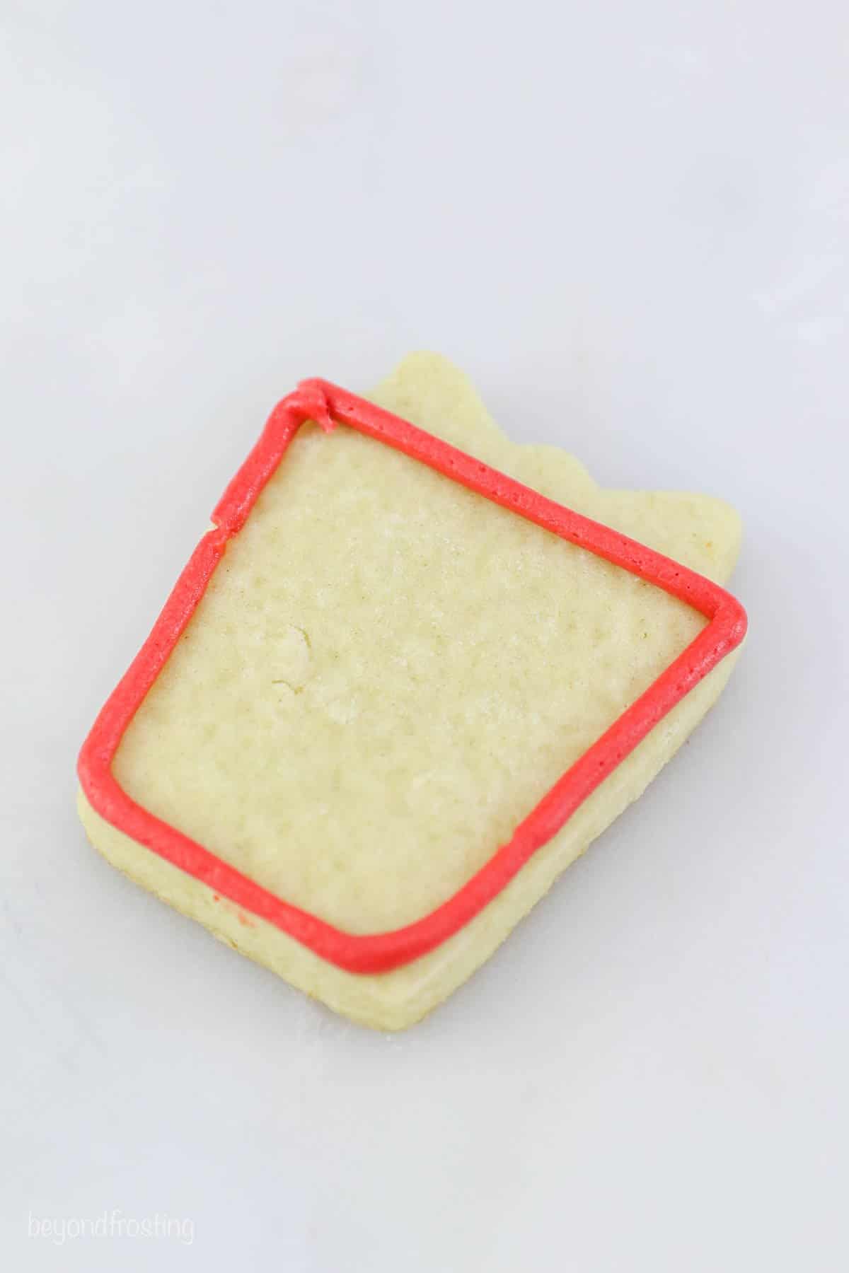 A red square outline on a Christmas cookie present