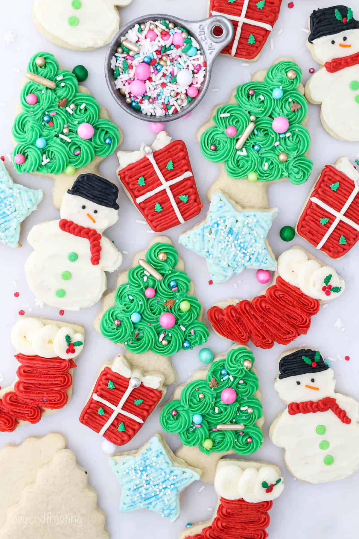 Overhead view of assorted frosted Christmas sugar cookies.