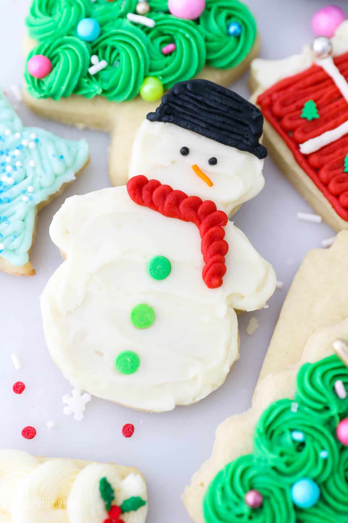 Overhead view of a snowman frosted sugar cookie