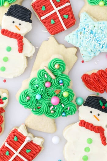 Overhead view of assorted frosted Christmas sugar cookies.