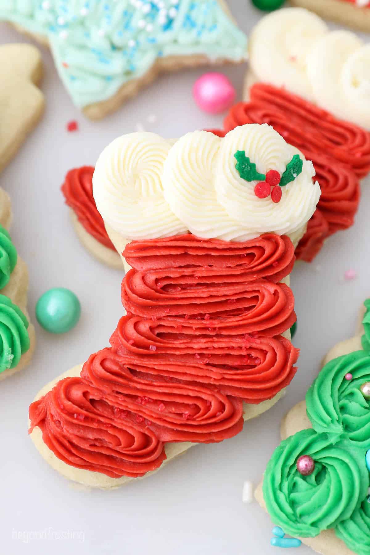 Close up of a frosted Christmas cookie in the shape of a stocking