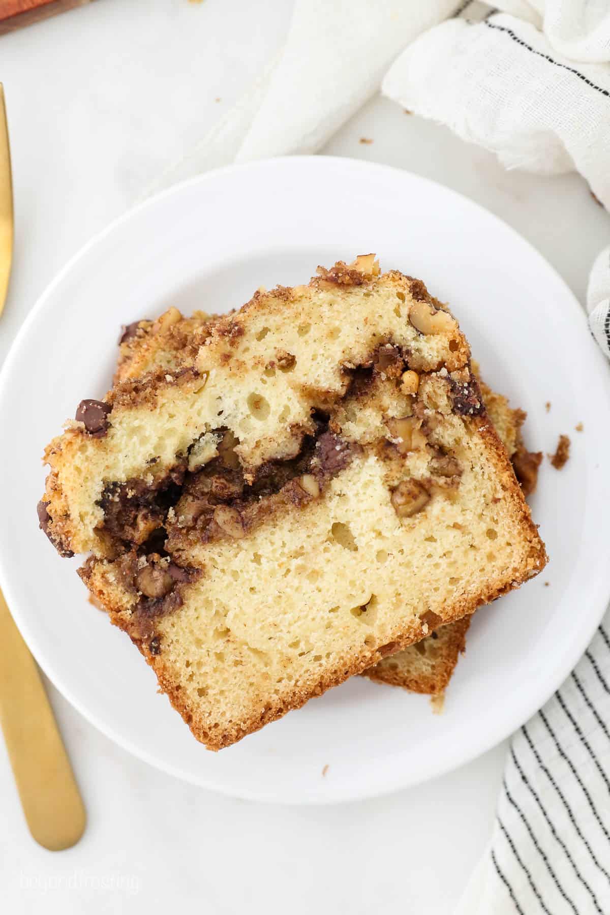 two slices of coffee cake with streusel topping on a plate