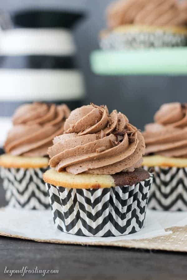 A close up shot of a Baileys marbled vanilla and chocolate cupcake with chocolate frosting