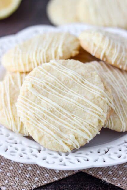 These Lemon Cake Mix Cookies are just what you need to brighten up the day. These lemon infused cookies are make with a lemon cake mix and drizzled with white chocolate.