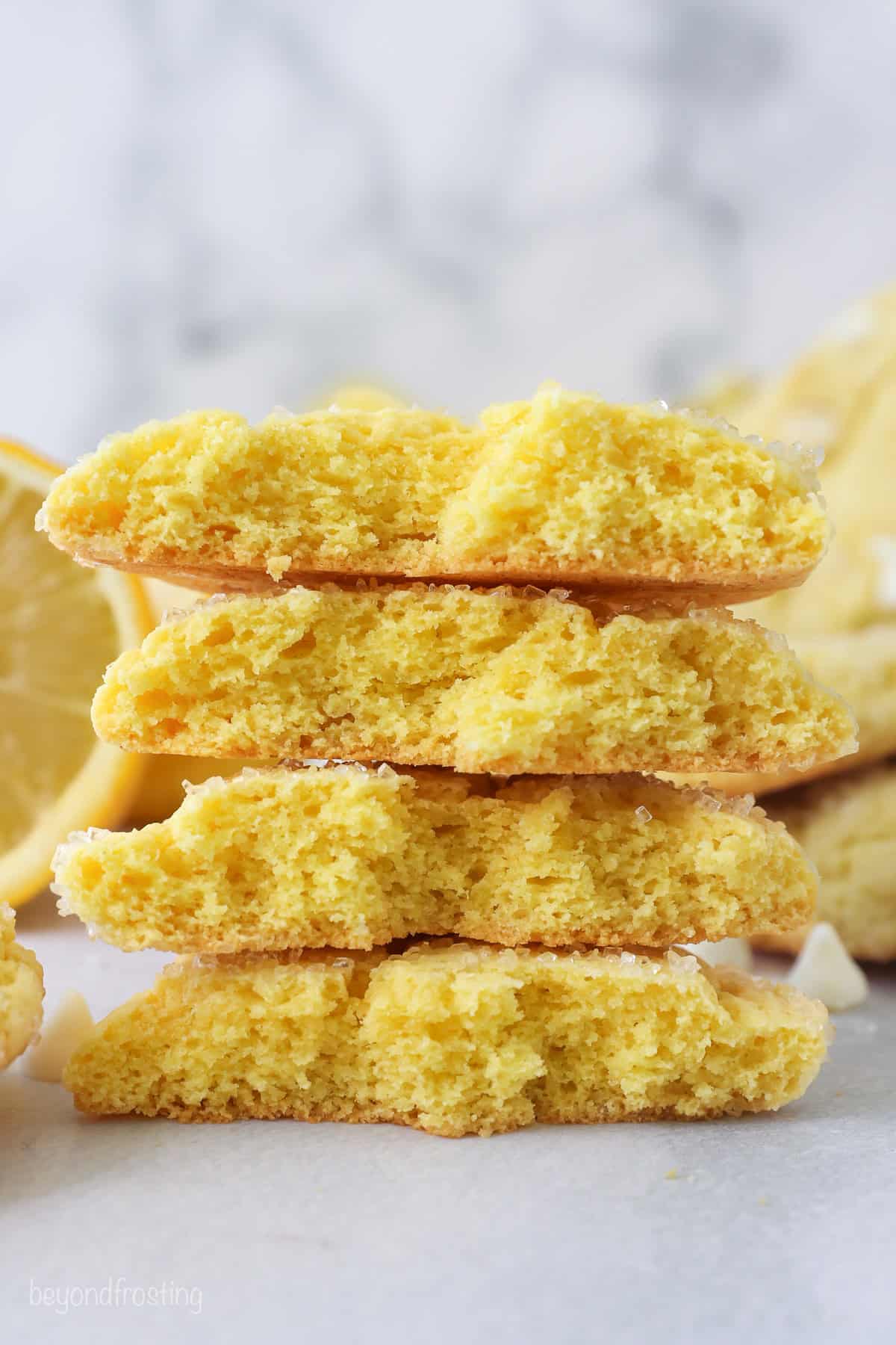 Side view of a stack of lemon cookie halves.
