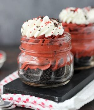 These Red Velvet Cheesecake Shooters have just the right amount of chocolate flavor. On the bottom, you’ve got a nice thick layer of Oreo cookies. Next, you have a smooth, red velvet no-bake cheesecake filling and it’s topped with a hint of whipped cream.