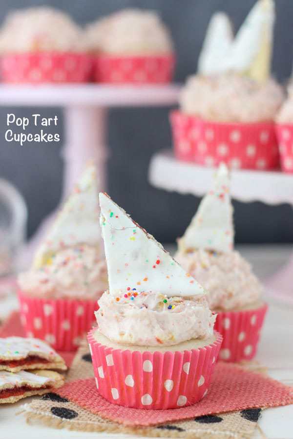 Strawberry Pop Tart Cupcakes. This recipe is a vanilla cupcake with a strawberry jam filling. There are crushed Pop Tart in the frosting too!