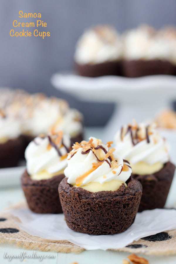 These Samoa Cream Pie Cookie Cups are a chocolate pudding cookie filled with a vanilla-caramel mousse and topped with whipped cream, toasted coconut and plenty of chocolate sauce and caramel. These are the next best thing besides samoa cookies. 