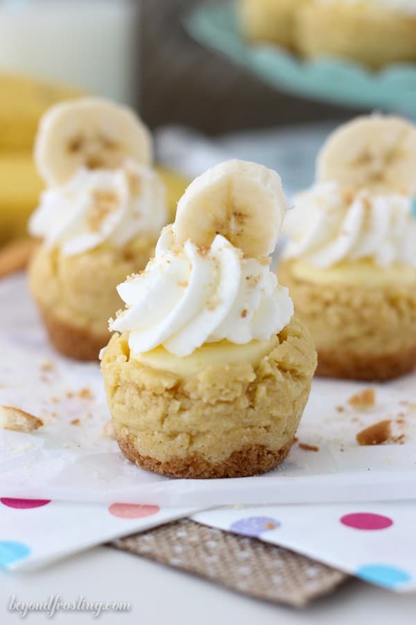 Three Bite-Sized Banana Cream Pie Cookie Cups on a Polka Dotted Placemat