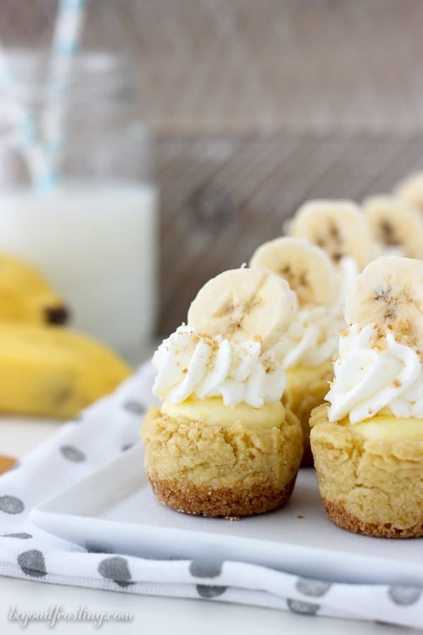 These bite-sized Banana Cream Pie Cookie Cups have a Nilla Wafer crust, a soft vanilla pudding cookie, Banana cream filling and topped with whipped cream and fresh bananas.