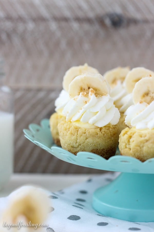 These bite-sized Banana Cream Pie Cookie Cups have a Nilla Wafer crust, a soft vanilla pudding cookie, Banana cream filling and topped with whipped cream and fresh bananas.