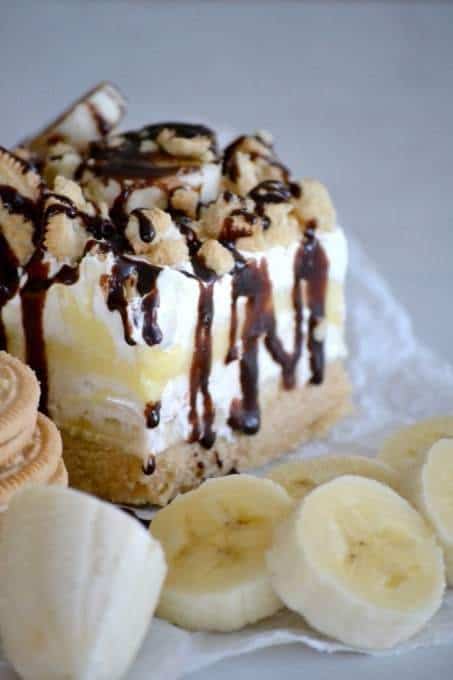 A Banana Pudding Dream Bar Next to a Pile of Banana Slices