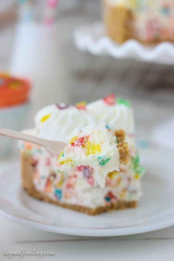 This No-Bake Fruity Pebbles Cheesecake is a Nilla Wafer crust with a light no-bake cheesecake filling and plenty of Fruity Pebbles inside.