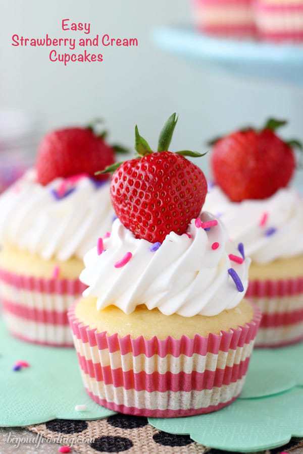 These Easy Strawberry and Cream Cupcakes are so refreshing. The strawberry cupcakes are filled with a light and airy mousse, and topped with whipped cream and more strawberries.