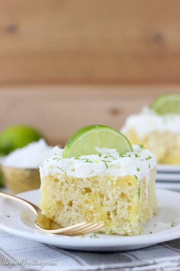 Fresh Coconut Lime Poke Cake is a vanilla coconut cake with fresh lime. It’s filled with a vanilla pudding and topped with coconut whipped cream. Find the recipe at beyondfrosting.com