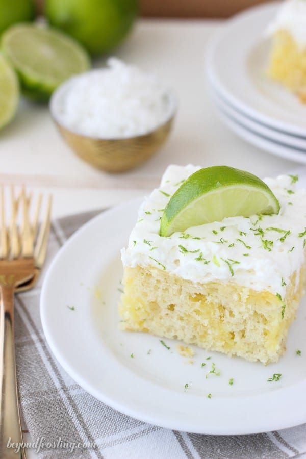 Fresh Coconut Lime Poke Cake is a vanilla coconut cake with fresh lime. It’s filled with a vanilla pudding and topped with coconut whipped cream. Find the recipe at beyondfrosting.com