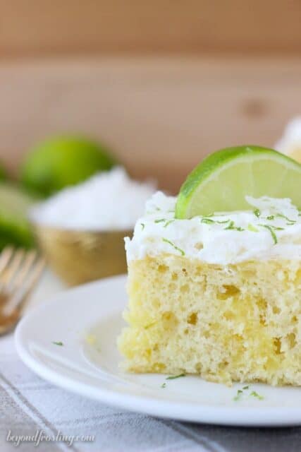 This Coconut Lime Poke Cake is a vanilla cake, with coconut milk, loaded with fresh lime and topped with a coconut whipped cream.