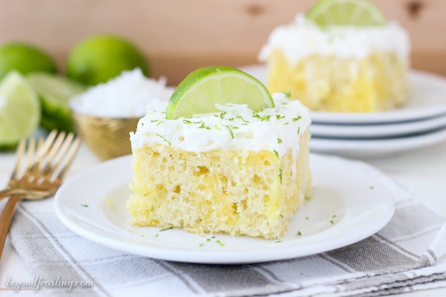 This Coconut Lime Poke Cake is a vanilla cake, filled with vanilla pudding and fresh lime. It’s finished off with a coconut whipped cream.