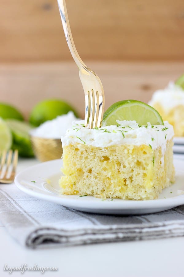 This Coconut Lime Poke Cake is a vanilla cake, filled with vanilla pudding and fresh lime. It’s finished off with a coconut whipped cream.