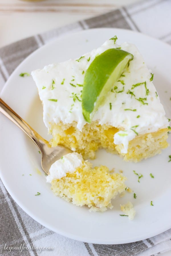 This Coconut Lime Poke Cake is a vanilla cake, filled with vanilla pudding and fresh lime. It’s finished off with a coconut whipped cream.