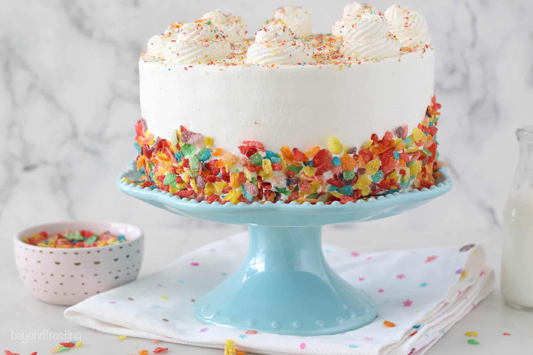 Angled view of a fruity pebble ice cream cake