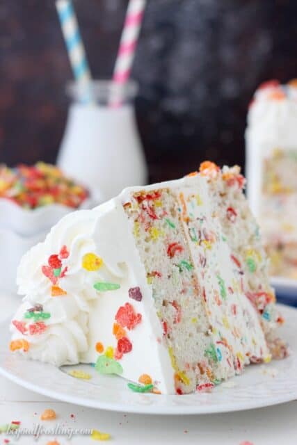 Ice cream cakes have never been so easy! This Fruity Pebble Ice Cream Cake is made with a simple vanilla, Fruity Pebbles cake, a quick, no-churn Fruity Pebble ice cream and a whipped cream frosting.