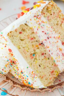 Angled view of a slice of fruity pebble ice cream cake